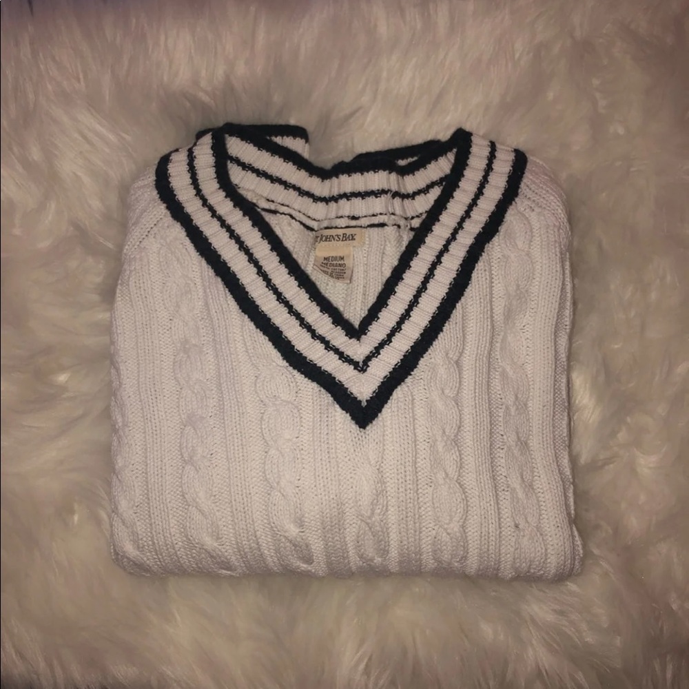 A navy blue and white knit sweater